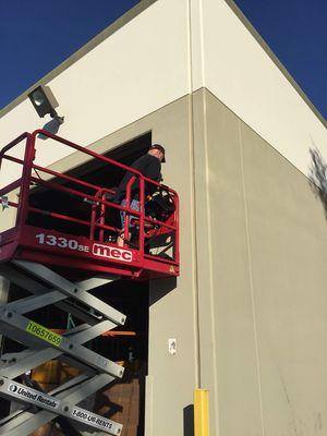 Dave utilized a scissor lift commercial building CCTV parking lot cameras up high. Over 40 cameras were installed on this project overall.