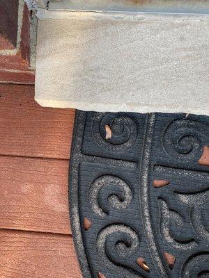 Don't know if you can tell the difference in cement by door wall. The corner is before power washing.