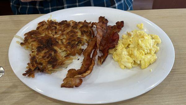 Hash browns, bacon, and eggs