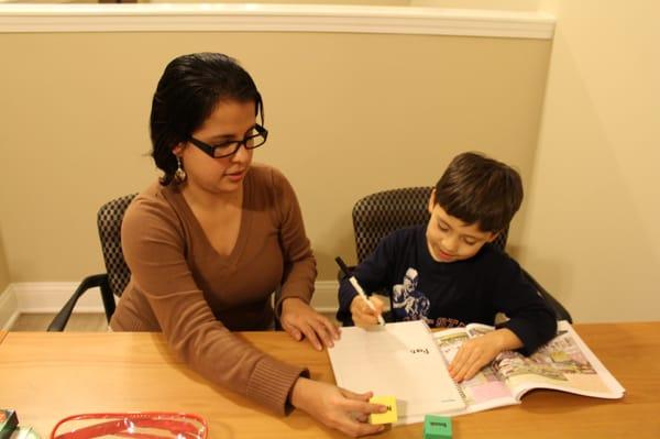 Vanesa teaching one of her students.