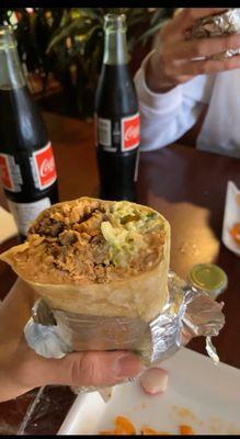 Burrito Loco with 3 meats (Asada, birria and pollo).