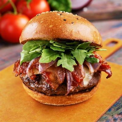 Free Range Buffalo Burger: Hand-pressed Bison, candied bacon, pepperjack, caramelized red onion, arugula, smoky chipotle