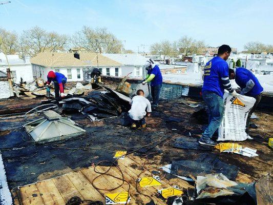 Ripping out 6 layers of flat roofing with the best crew all the way to the deck