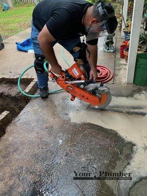 Concrete sawcut for access to sewer line repair.