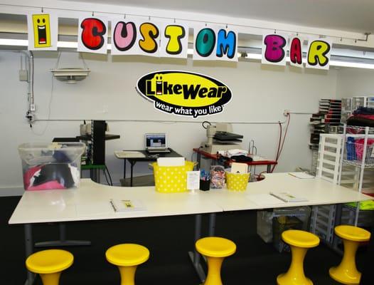 Choose from 100s of graphics and rhinestones at our CUSTOM CLOTHING BAR... then watch as we make it for you in seconds.