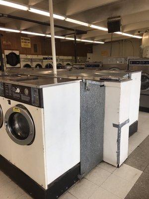 Older machines mostly, but there are some newer. Different sized washers with dryers on back wall.