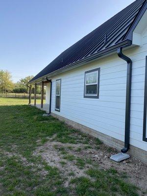 Gutter installation on this modern farmhouse style home