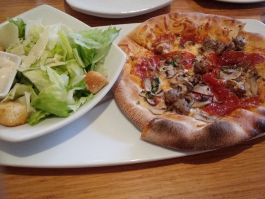 Mushroom and pepperoni pizza and Caesar salad