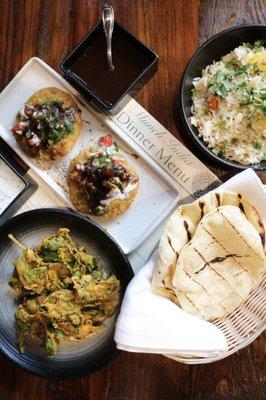 Tamarind chutney, kachori chaat, chickpeas with crispy spinach, flatbread, basmati rice