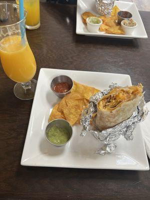 Breakfast burrito with chorizo and potatoes Fresh squeezed orange juice