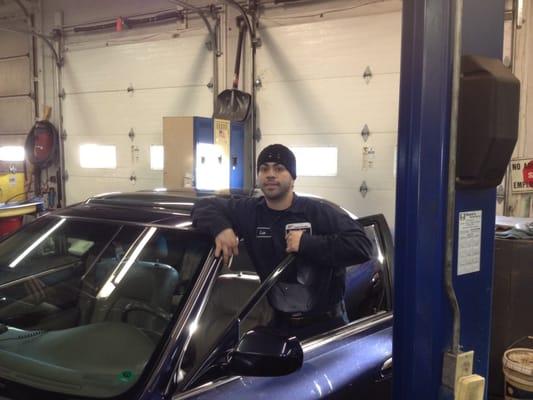 Leo cleaning the cars after repairs.