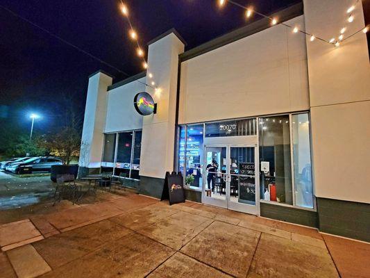 The storefront. The back parking lot of Ashbrook Commons Plaza is to the left.