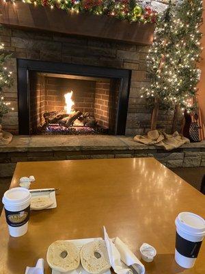 Bagels and coffee in front of the fireplace