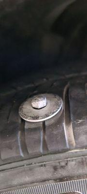 Bolt in tire we discovered as soon as we got home. Thought it was a rock when we drove away from Exotic Motors Auto Rebuild.