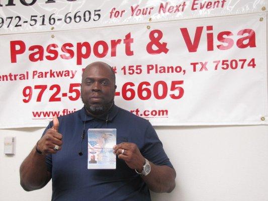 Happy faces and his passport.