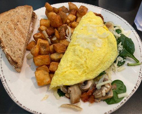 Veggie omelette with country potatoes and toast