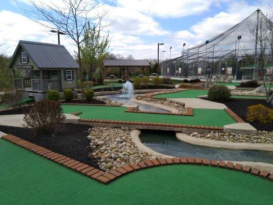 One of the mini golf courses with the batting cages in the background