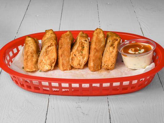 #Buffalo Chicken Eggrolls
Buffalo chicken deep fried in a crispy egg roll wrappa'. Your choice of Ranch or Blue Cheese Dressing.