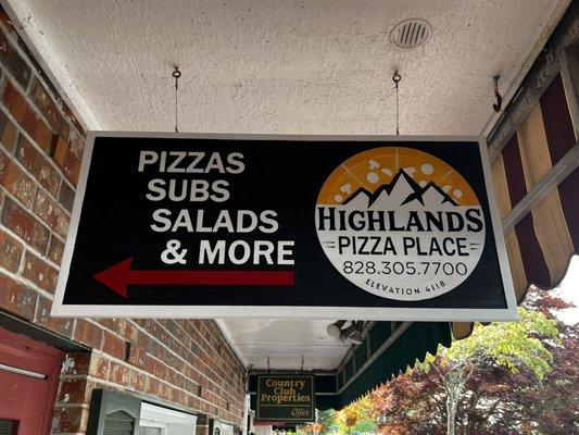 Located in beautiful Highlands NC on Main Street - look for this sign for hot, fresh pizza, sandwiches and salads!