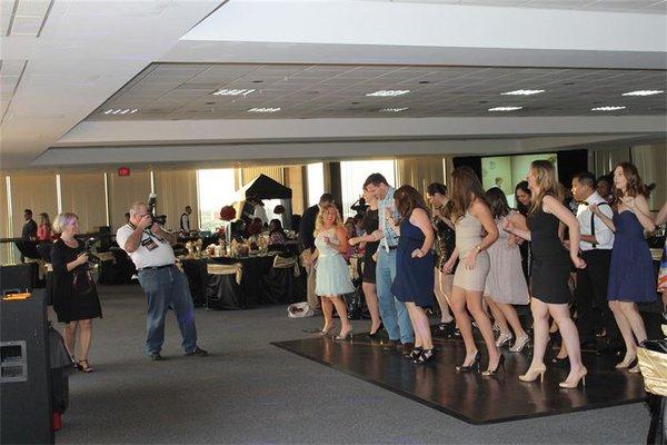 Guests dancing at Milestone Memories & Events gala.