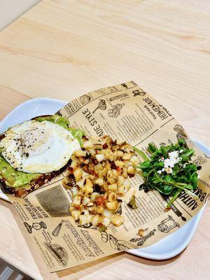 Avocado toast with egg and Cajun potatoes.