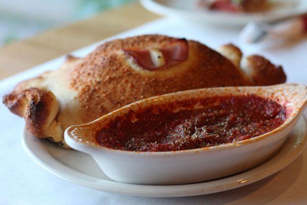 CALZONES - Every CalZano is hand-prepared to order. A garlic infused dough baked with cheese and up to three toppings of your choice.