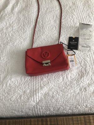 My Valentino bag with receipts and tags inside