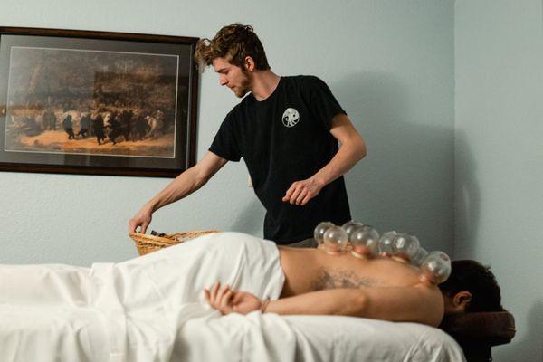 Fire cupping through the energetic pathways of the body