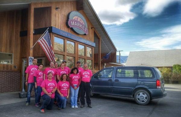 Market staff showing up in style for breast cancer awareness.