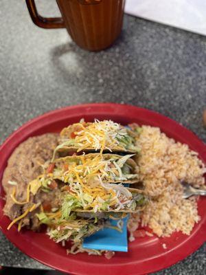 Beef and cheddar taco plate with beans and rice. Very tasty! Comes with 4 tacos.