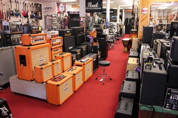 Orange, Marshall, Blackstar, and Vox amps are plugged in and ready to go!