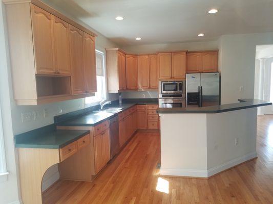 Installed new cabinets and a sleek black quartz countertop, giving the kitchen a modern and sophisticated touch