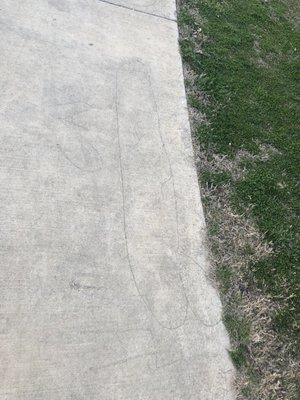 Penis carved into the sidewalk, real classy