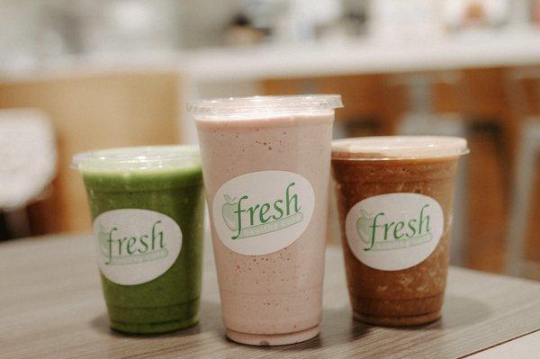 Sippin' on smoothies! On the left we have our Green Machine Smoothie. This smoothie will fill you with veggies and fruits.