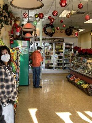 Inside the store with a wall of drink options