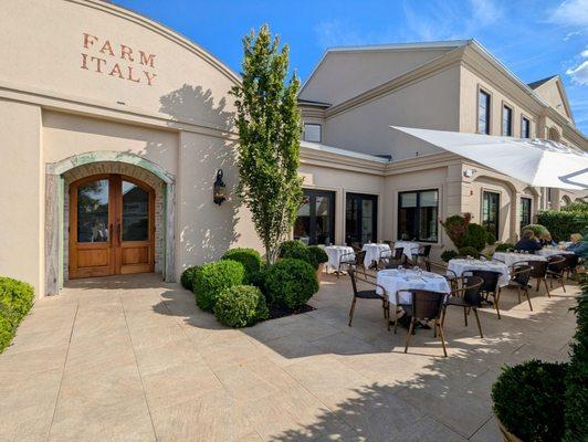 Exterior of restaurant with front entrance and outdoor patio.