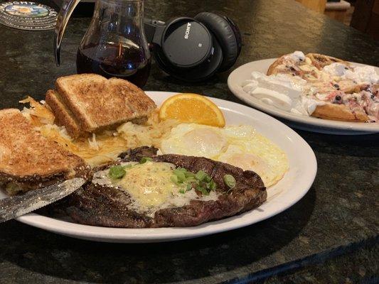 Ribeye with a side waffle with whipped cream and Huckleberry.... cause why not