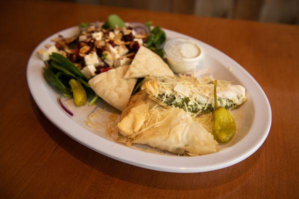 Warm, flaky, creamy house made spanakopita. Get it as an appetizer or a platter with a salad.