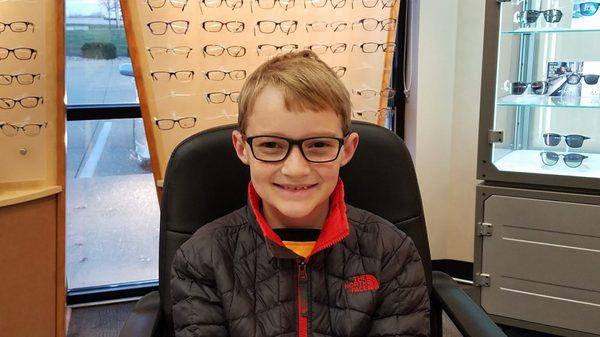 He was super happy to get his new glasses.