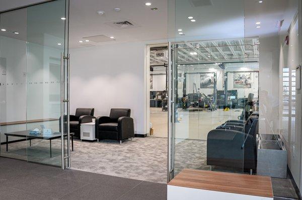 The customer lounge has glass walls so that customers can watch their vehicles being serviced.