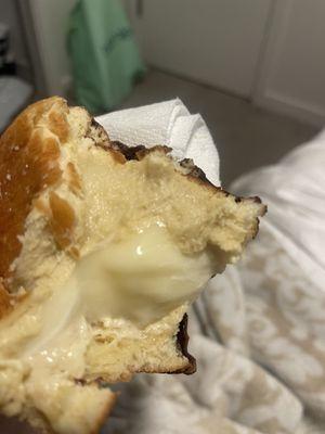 Boston cream donut raw on the bottom of the cream