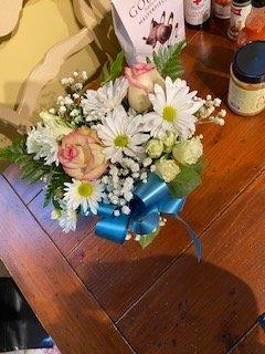 BOUQUET #2 SHE RECEIVED. HIDEOUS. What is that blue ribbon? We didn't ask for that.