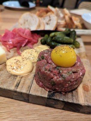 Beef Tartare. $19. Horseradish cheddar, pickled red onion, chili aioli, 64-degree egg, crostini.