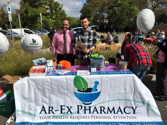 Our front-store manager Paul with pharmacist Anil at one of our outreach programs!