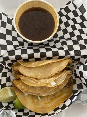 Birria tacos with broth