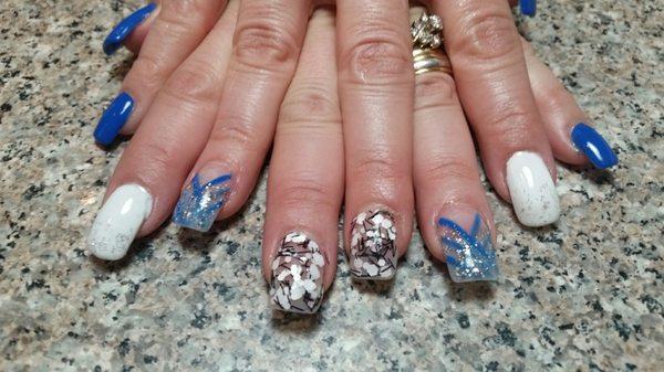 I absolutely love my blue nails.  Jimmy is awesome...so creative and knows I love some bling....