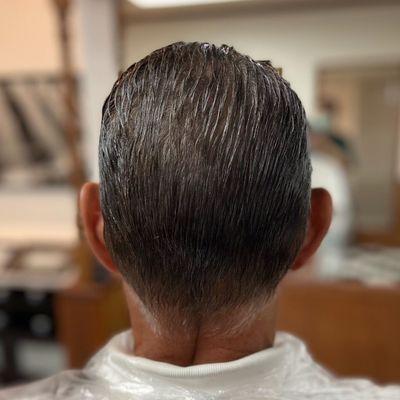 Scissor cut into a soft, classic taper in the back.