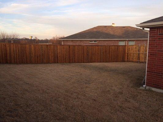 Standard 6' pre-stained white wood side by side with 2x6 baseboard and trim board on top.