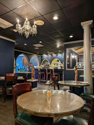 Inside the dining room, facing the bar and entrance area. This is one of a few different dining spaces they have in here. Spacious place.