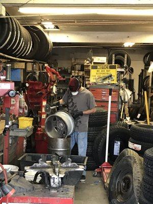 Service tech Matthew removing corrosion from my trucks wheels.